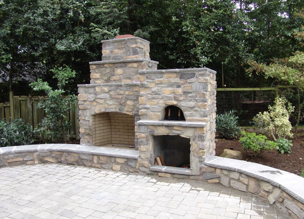 Custom outdoor fireplace and kitchen masonry construction in Ann Arbor
